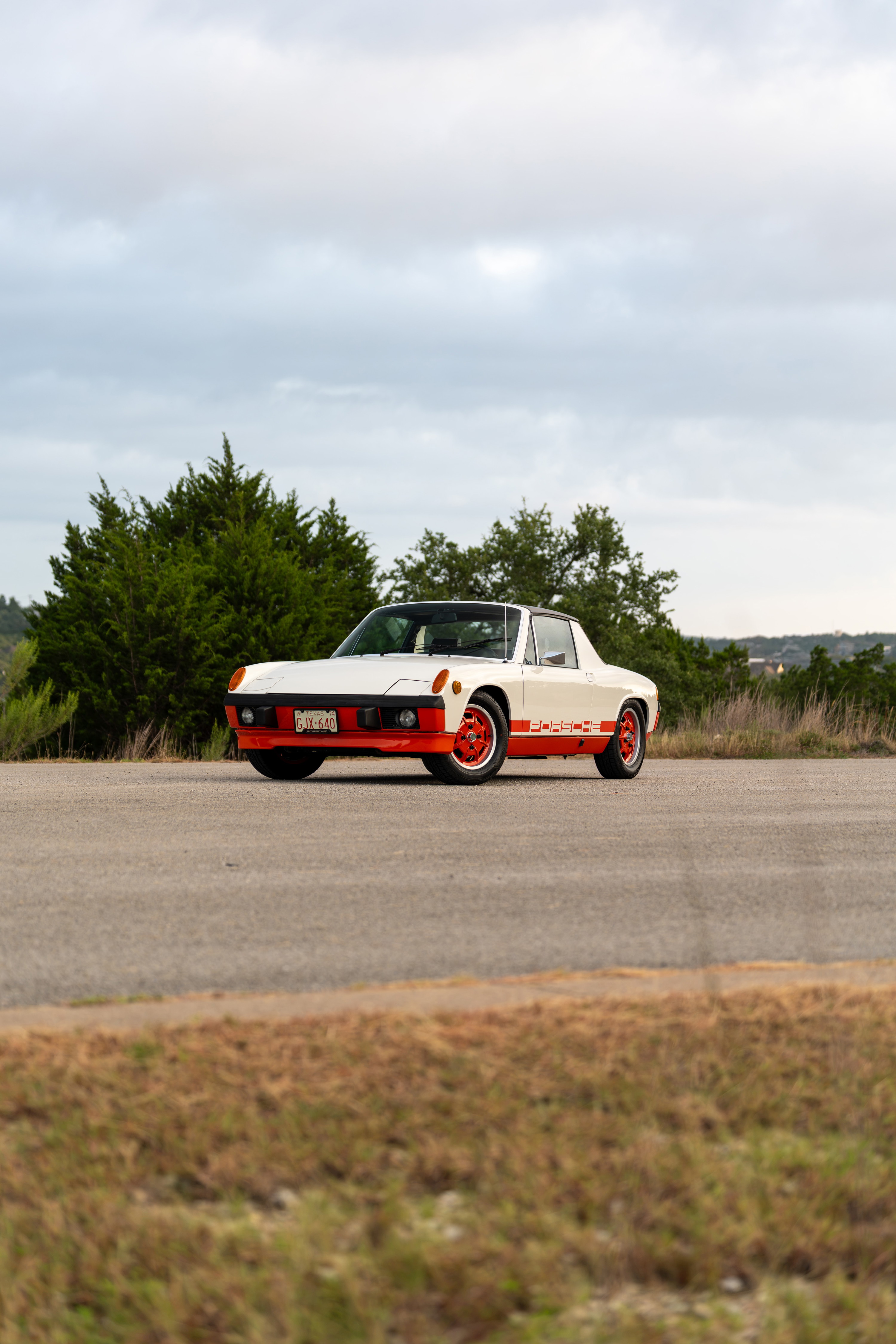 1974 Porsche 914 Can-Am LE in cream and orange. Features distinctive orange front bumper and side livery.
