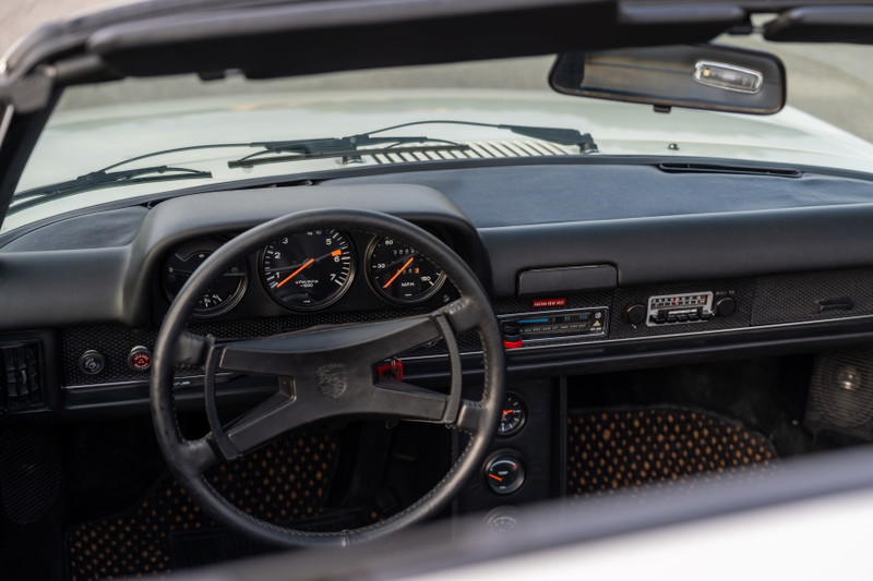 1974 Porsche 914 dashboard with three-gauge cluster and original radio.